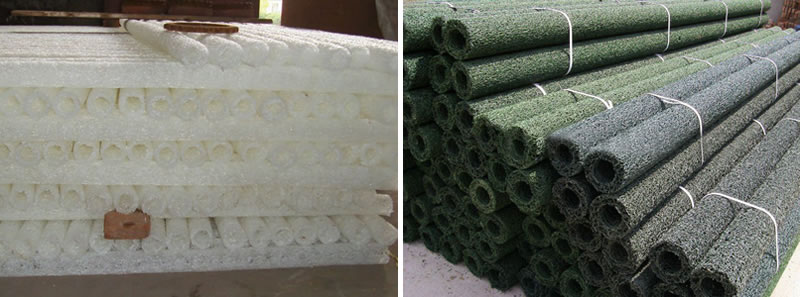 White, black and green circular plastic blind drains are piled up orderly.