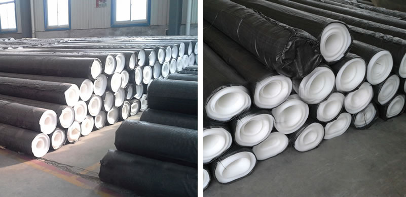 Many rolls of EVA geomembrane are packaged with black woven bags and put orderly on the ground in the factory.