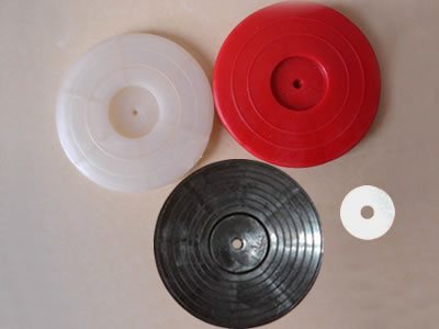 Three nonporous hot melt gaskets with white, red and black colors, and a small piece of iron plate is between them.